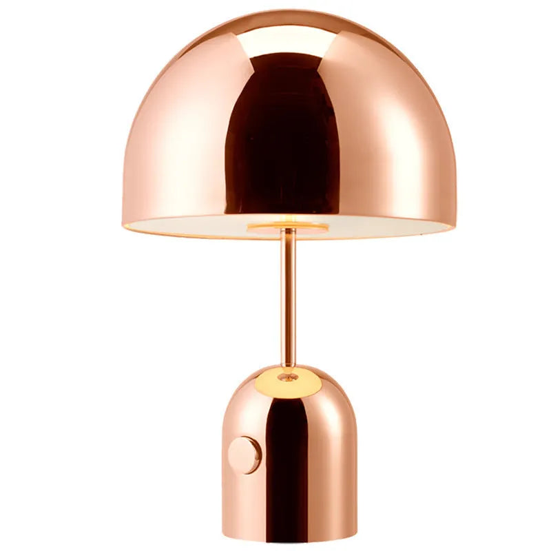 Mushroom table lamp with metal base in Rose Gold finish on wooden table
