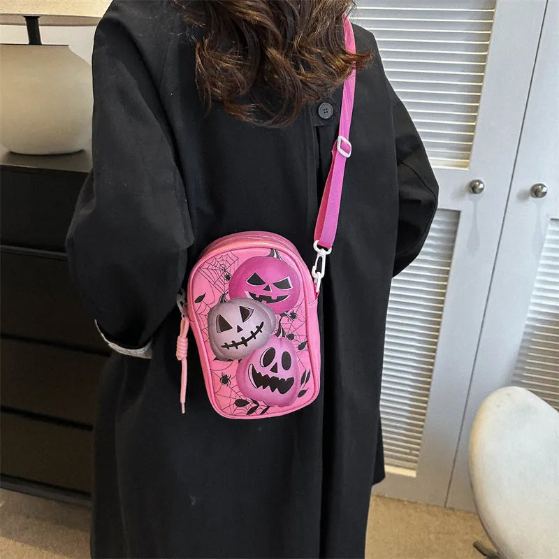 Halloween graffiti print crossbody bag with pumpkin ghost bat designs in black colour
