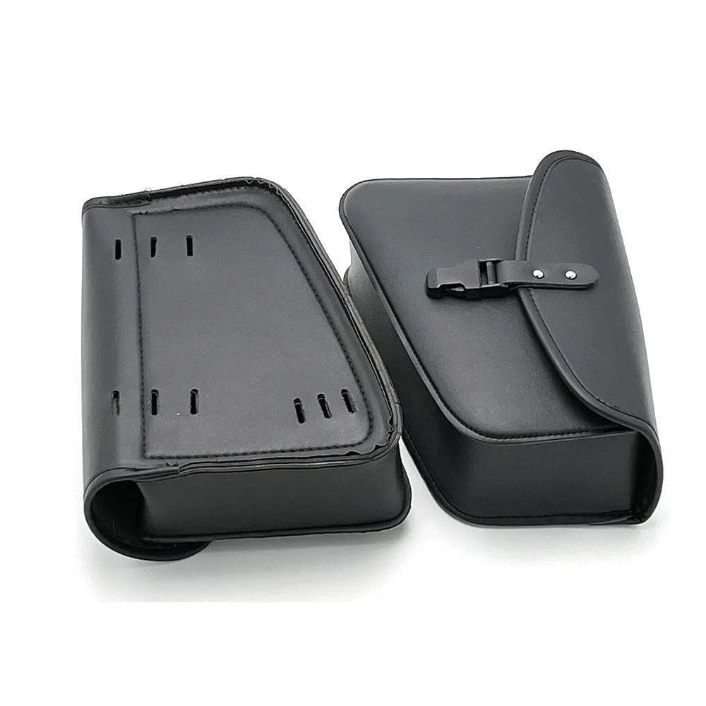 Black PU leather motorcycle swingarm saddlebag mounted on a Harley Sportster, showing side storage compartment.