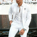 Men's white two-piece wedding suit with slim fit styling and cotton-acetate fabric blend