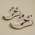 Women's solid colour low top sports shoes with flat platform heel and lace-up front.