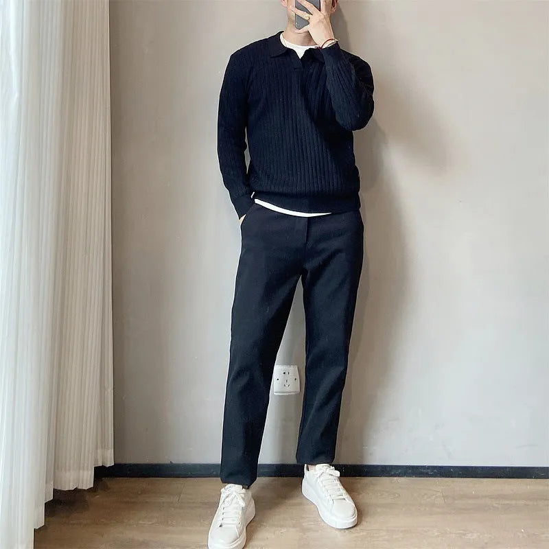 Men's loose grey knitted sweater with a textured striped lapel, shown on a model.