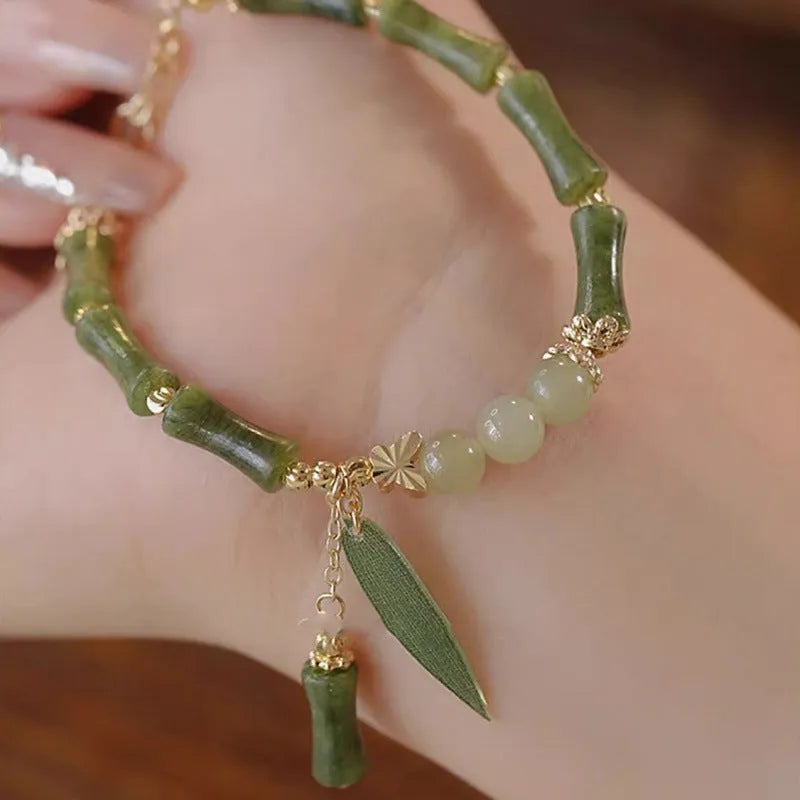 Chinese style glass bracelet with bamboo joint element in multiple colour variations