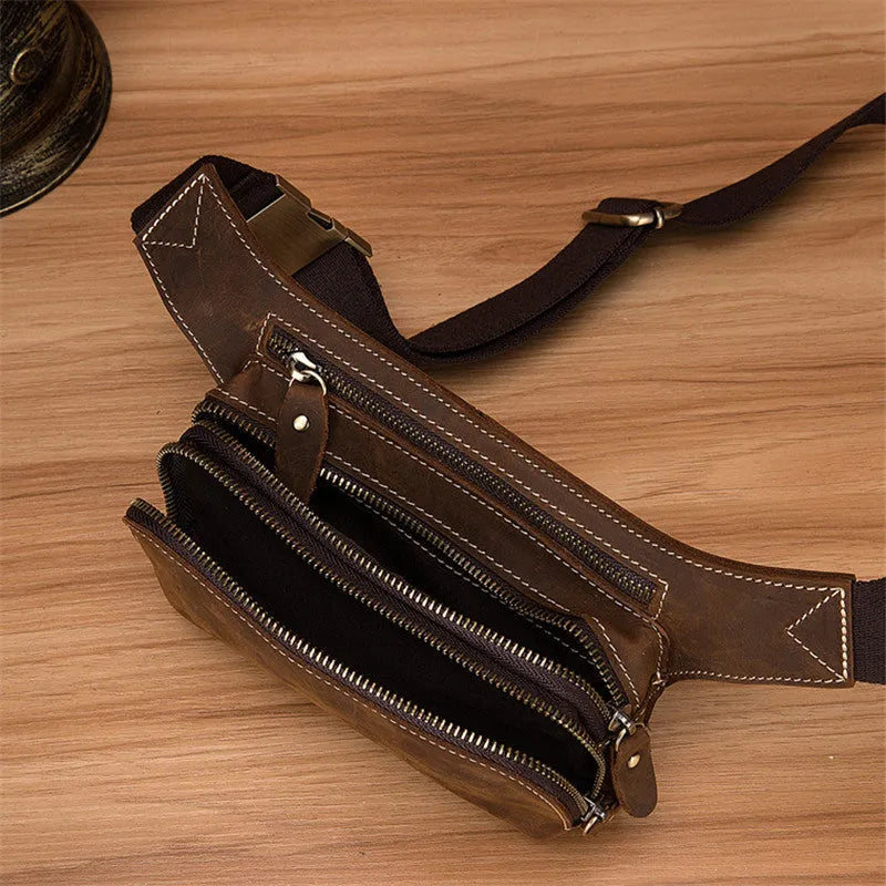 Brown cow leather men's sports waist bag showing internal phone pocket