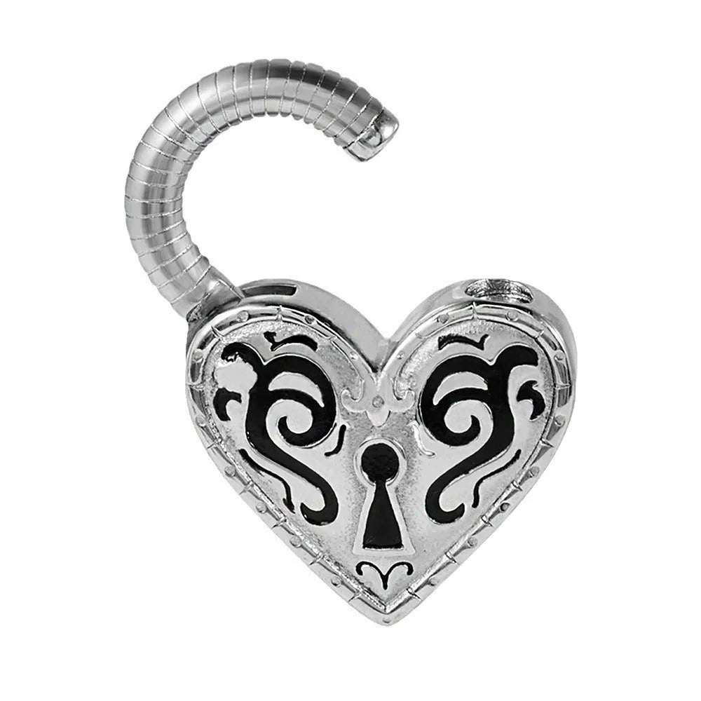 Close-up of a women's stainless steel heart-shaped ear piercing in a gold colour finish.