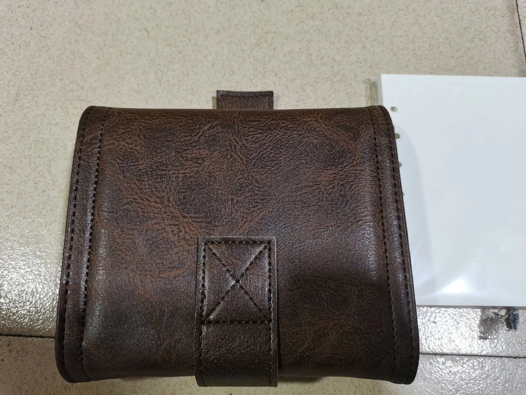 A7 brown PU leather-style notebook with loose-leaf binder binding, open to show 40g raw wood pulp paper
