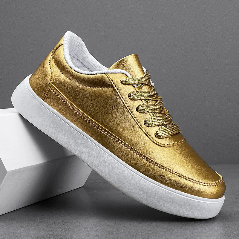 Women's gold leather lace-up casual flat shoes on a white background, showing front and side views.