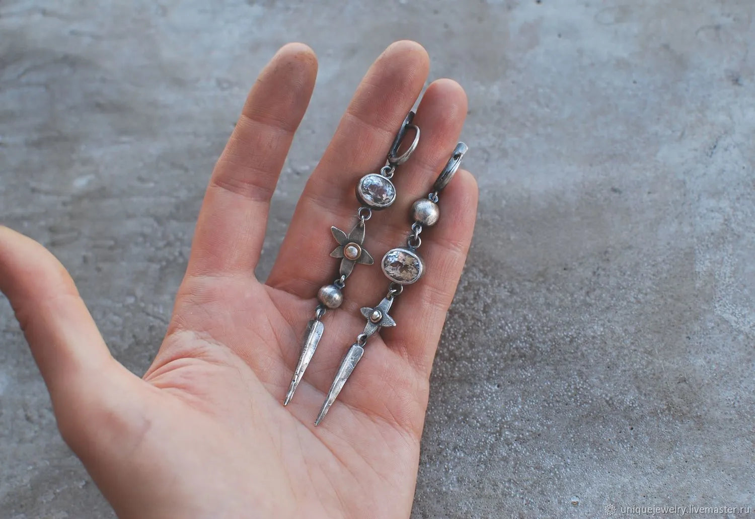 Geometric antique silver earrings with rhinestone accents and XINGX pendant design