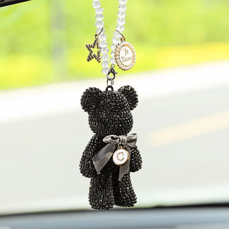 Diamond-embedded Violent Bear car rearview mirror pendant in black, white, and mixed pastel colours.
