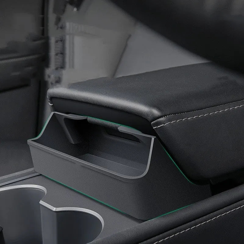 Black silicone glasses case installed in Tesla Model 3/Y centre console armrest compartment