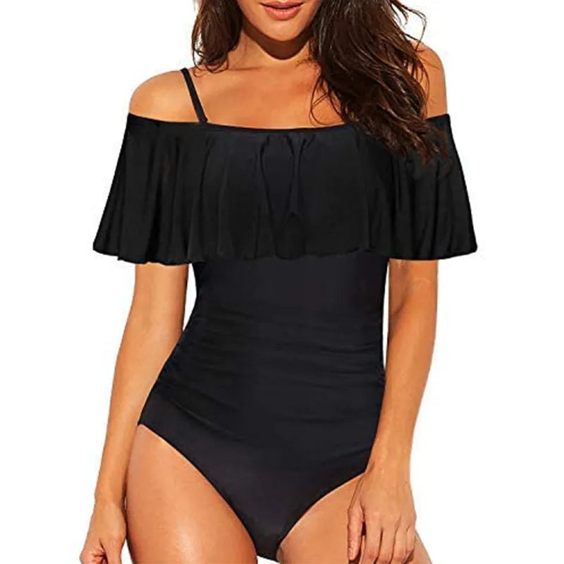 Black one-piece swimsuit with ruffled cut-out tube top design on a mannequin.