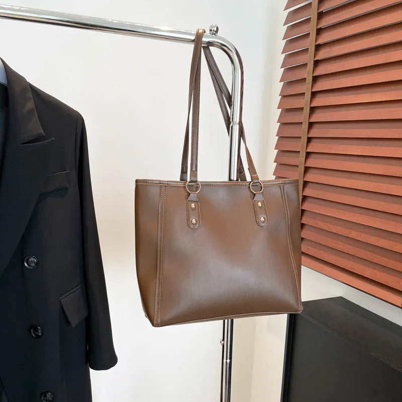 Korean-style black PU leather horizontal square shoulder underarm bag with an outer sandwich pocket.