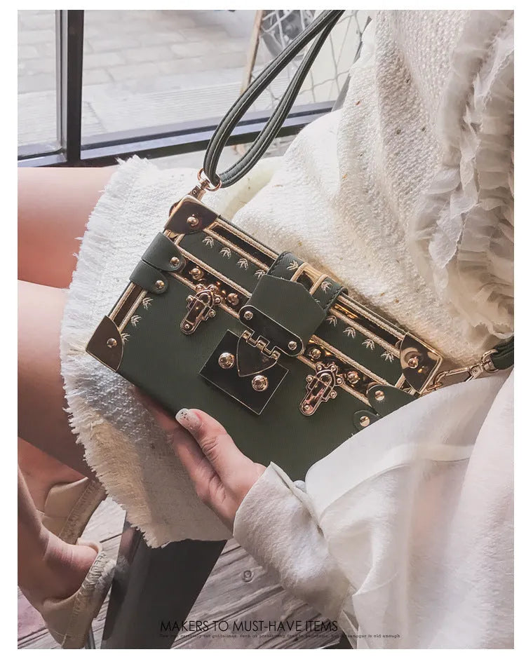 Women's hard-shell PU shoulder bag with flap closure in black or green