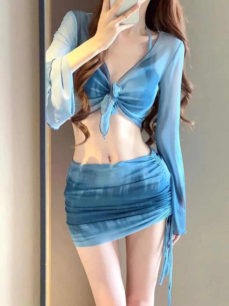 Blue women's four-piece bikini swimsuit set with high-waist briefs and a backless top.