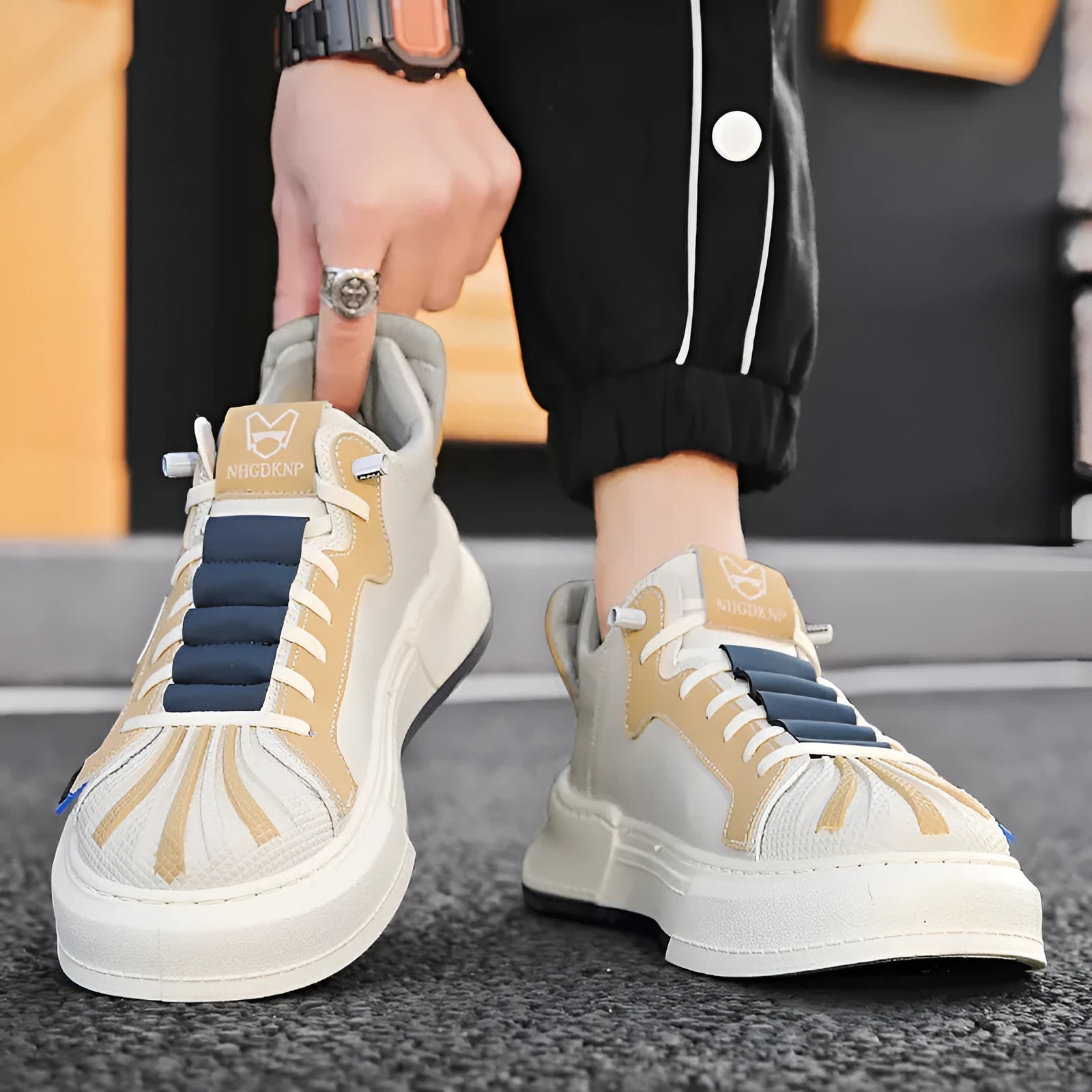 Men's beige low-top casual sneakers with elastic band closure and leather stitching details