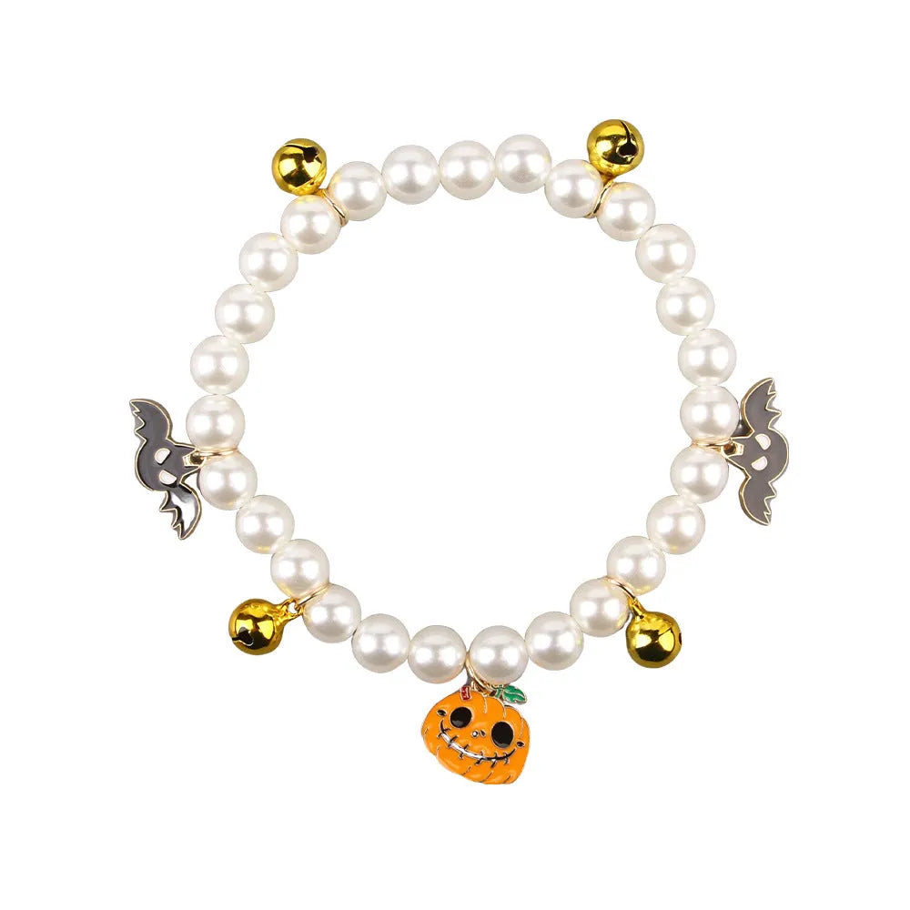 Purple Halloween cat collar with simulated pearl necklace decoration showing pumpkin designs