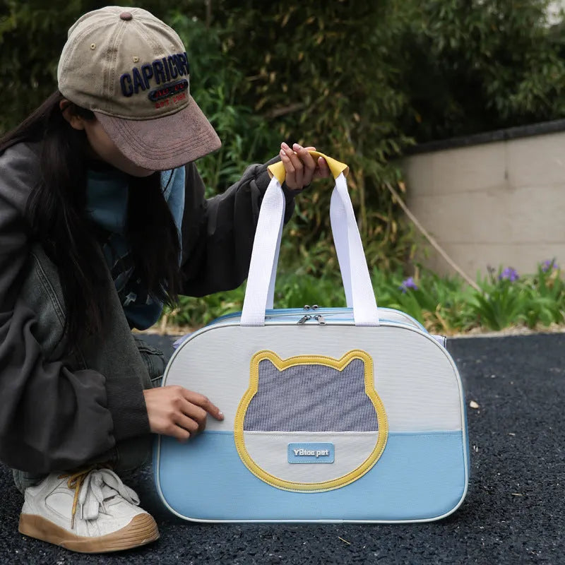 Blue outdoor portable foldable cat backpack with mesh panels, shown with a cat inside.
