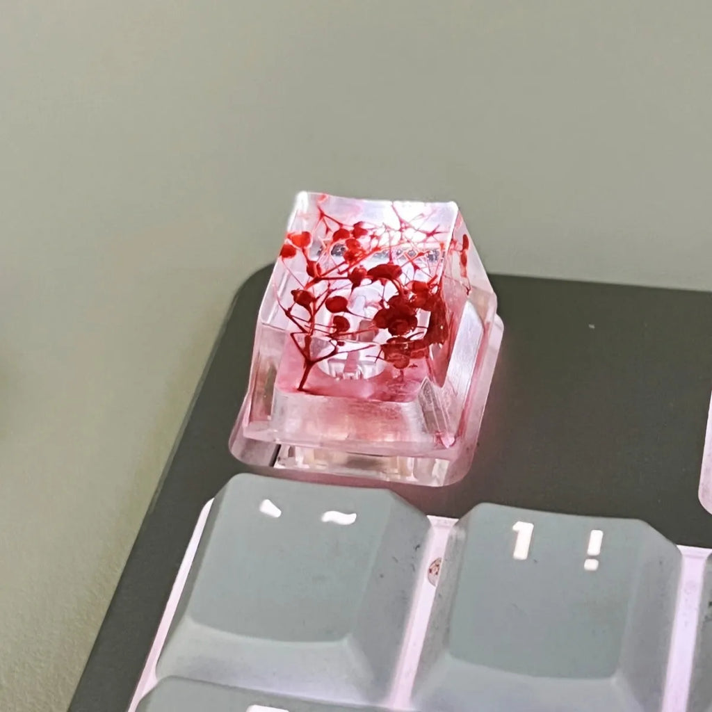 A high-transparency resin mechanical keyboard keycap with a starry sky design, shown in a choice of colours.