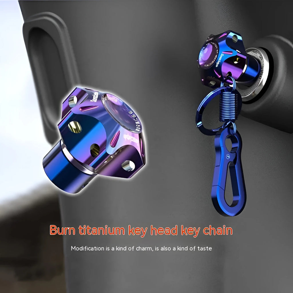 T6 aluminium alloy motorcycle key cover heads in hexagonal, plum blossom, and five-pointed star designs with blue and white key chain.