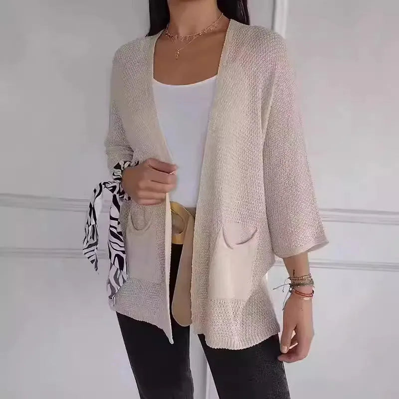 Women's waffle texture cardigan coat with nine-quarter sleeves in army green colour showing pocket details