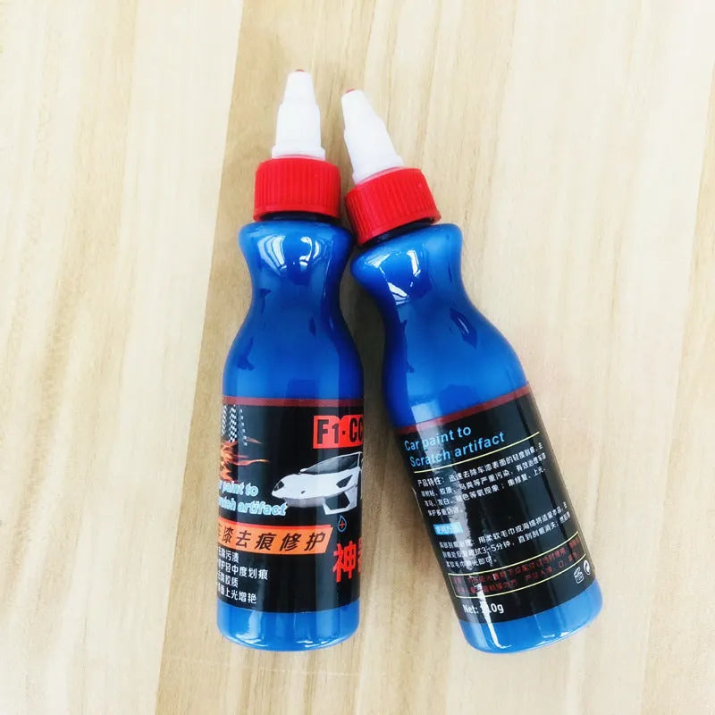 Blue car scratch repair kit with applicator tool for automotive paint touch-ups