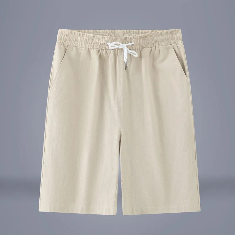 Solid colour cotton linen cropped summer pants with a drawstring waistband on a hanger.