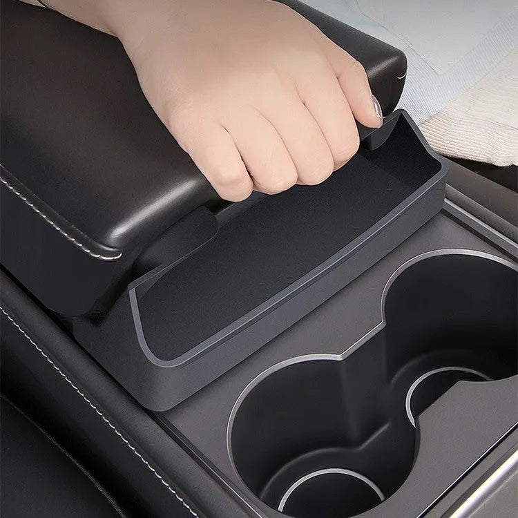 Black silicone glasses case installed in Tesla Model 3/Y centre console armrest compartment