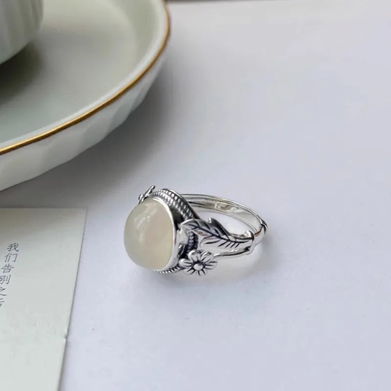 Adjustable copper vintage ring with white chalcedony stone and open mouth design