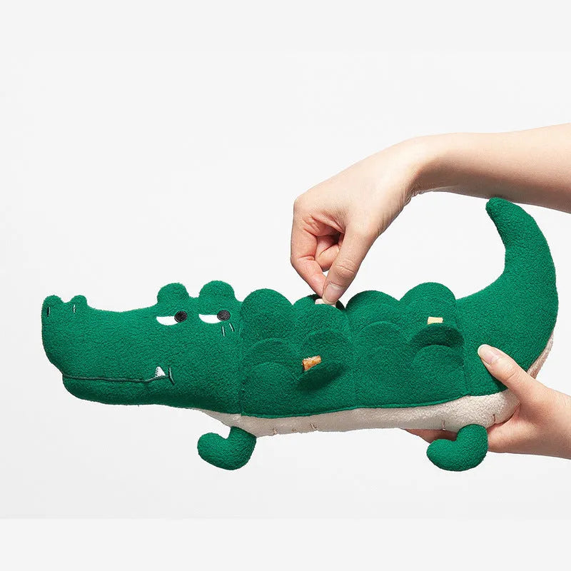 Green soft plush dog toy on a white background, showing its size and texture.