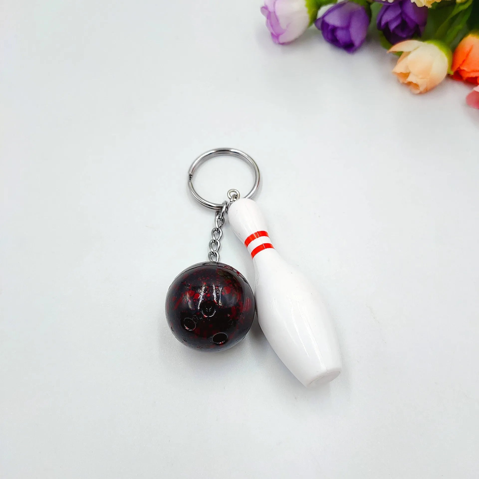Mini bowling ball simulation keychain pendant in dark red, blue, purple and green colour options