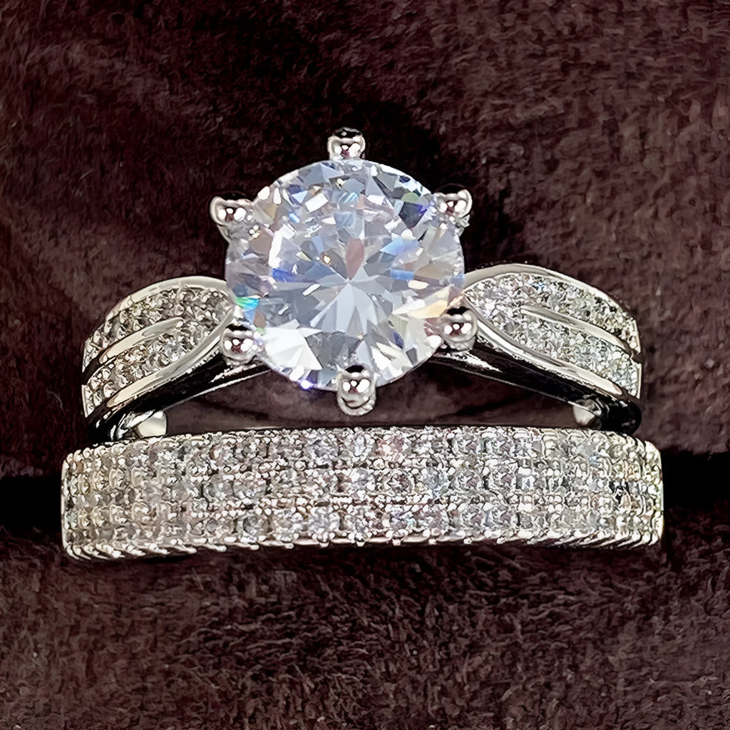 White gold colour geometric alloy wedding ring on a finger, showing its simple round band design.