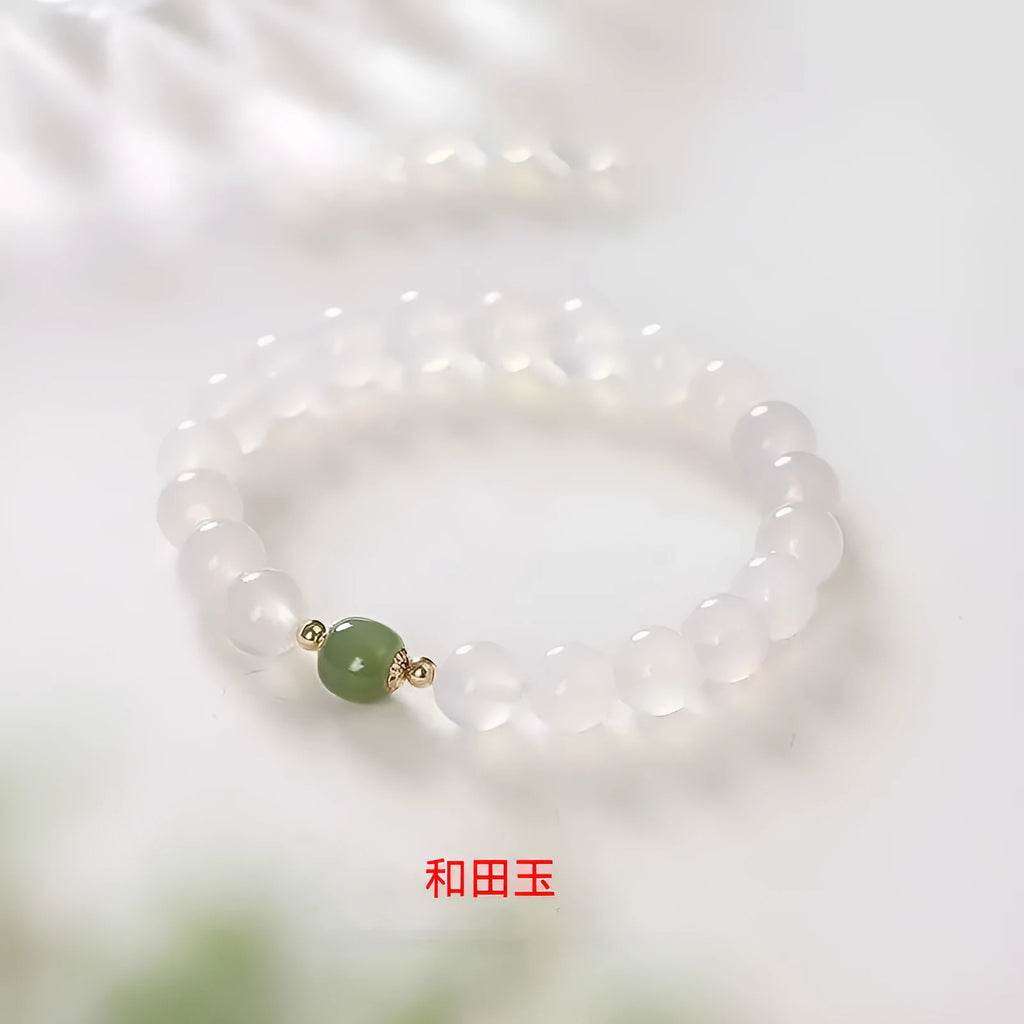 Handmade white agate and crystal bracelet with cinnabar inlay, showing 6mm or 8mm bead size.