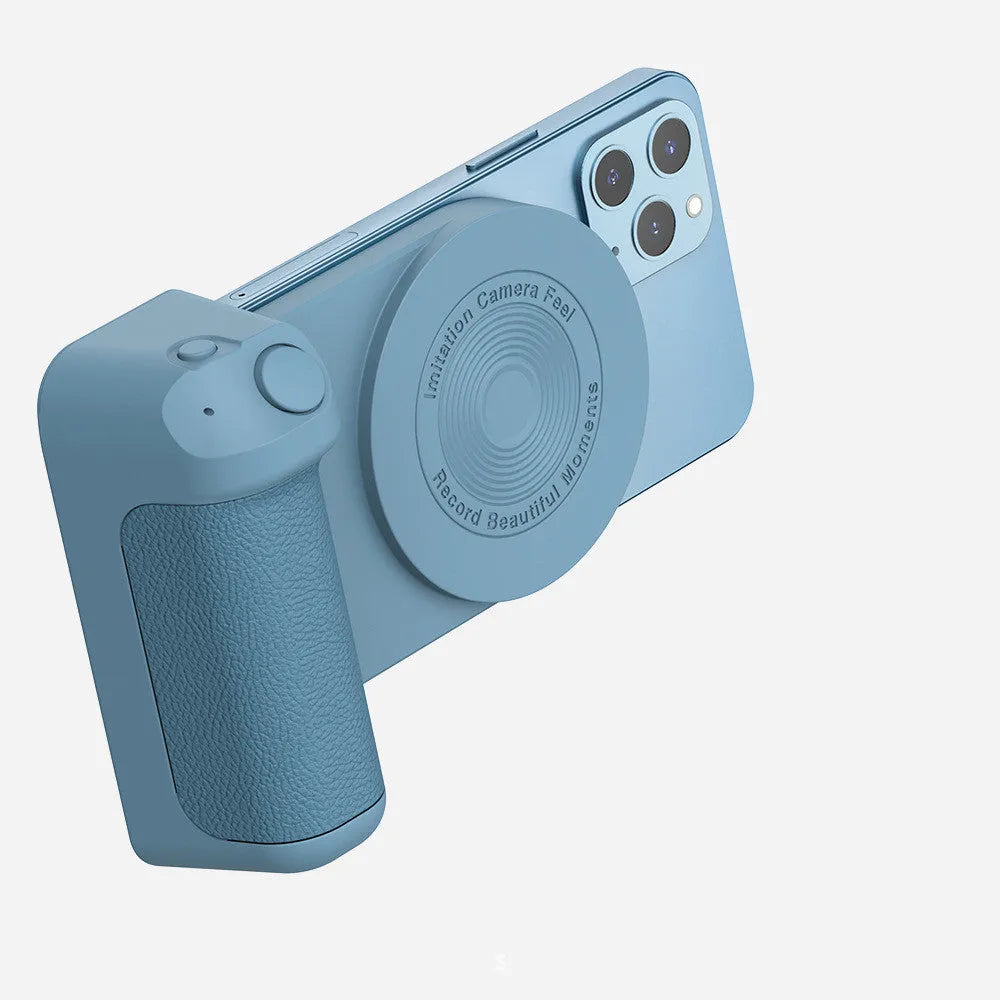 Black multifunctional magnetic phone camera holder with ergonomic PU leather grip on a table.