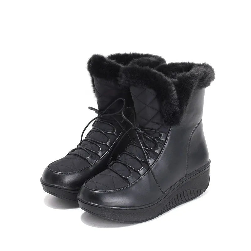Women's black lace-up winter boots with a platform heel on a white background.