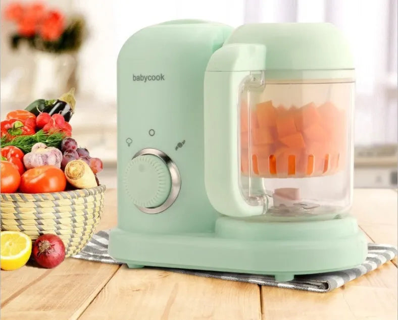 Baby food processor with steamer and blender functions in green or pink colour