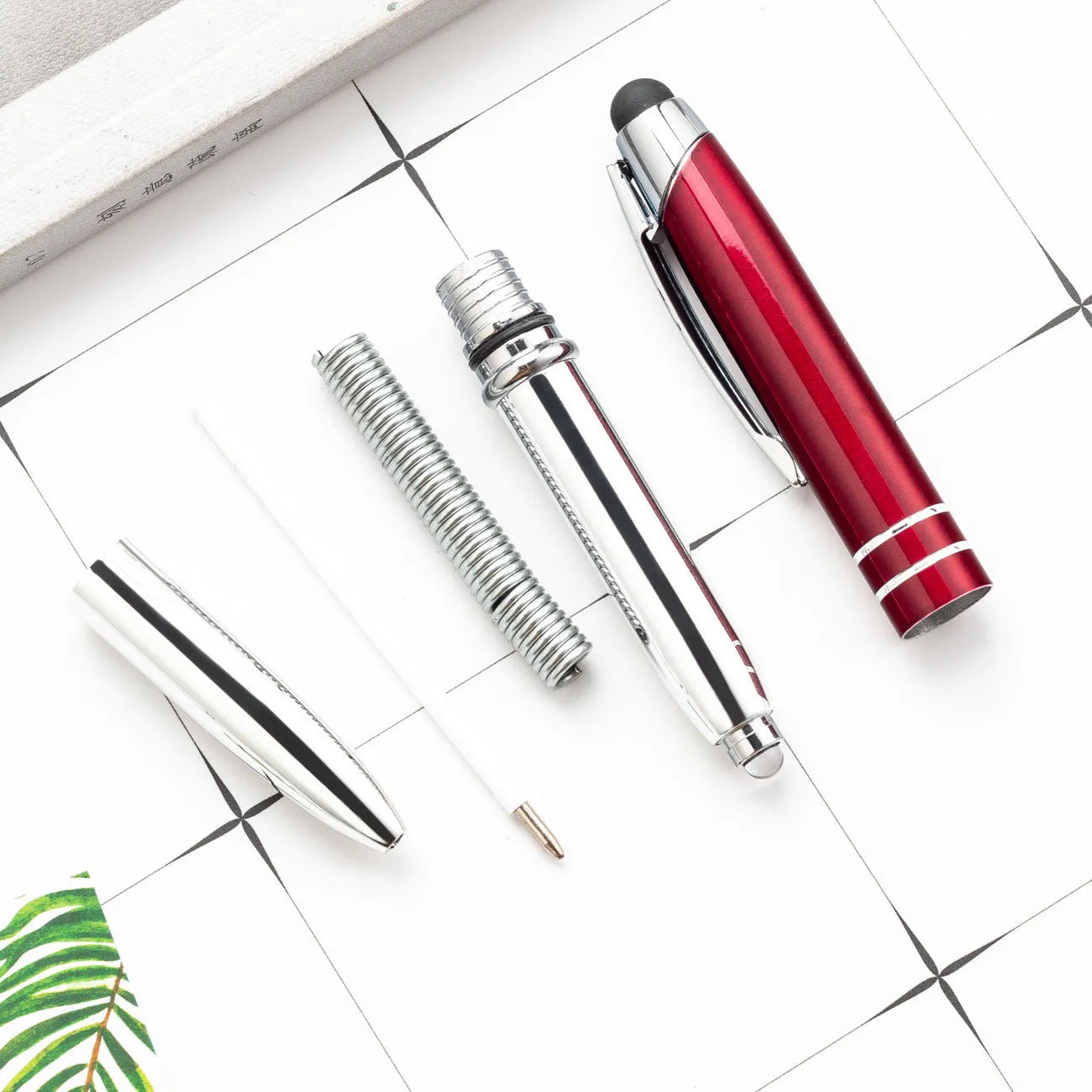 Red multifunctional metal ballpoint pen with capacitive stylus tip and LED light