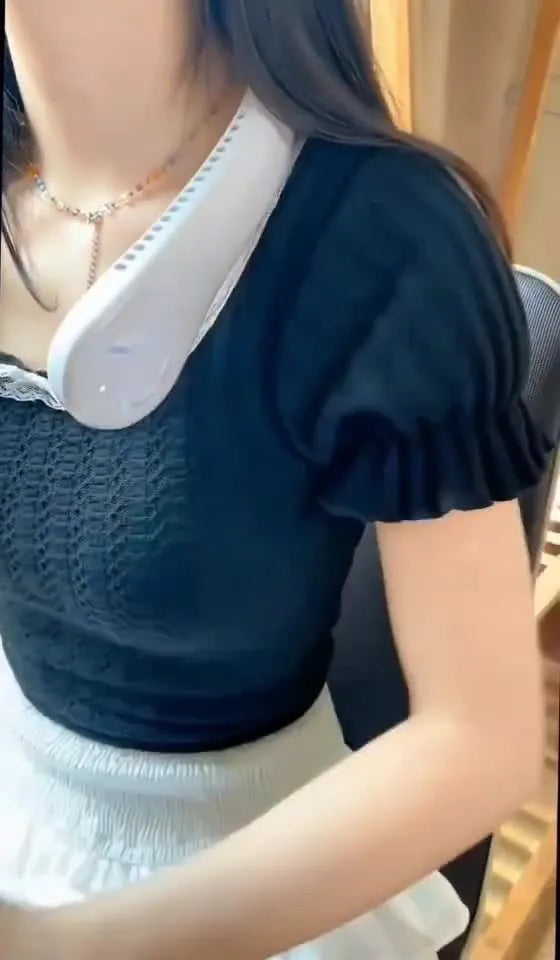 Pink bladeless neck fan with soft neckband, showing USB charging port and control buttons.