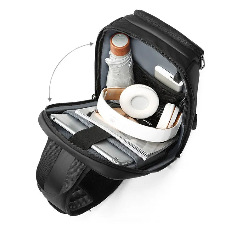 Black medium PVC outdoor shoulder bag showing air cushion strap, soft handle, and internal organiser pockets.