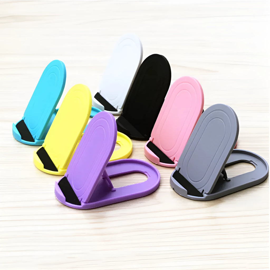 A plastic lazy bracket phone stand holding a mobile smartphone on a table.