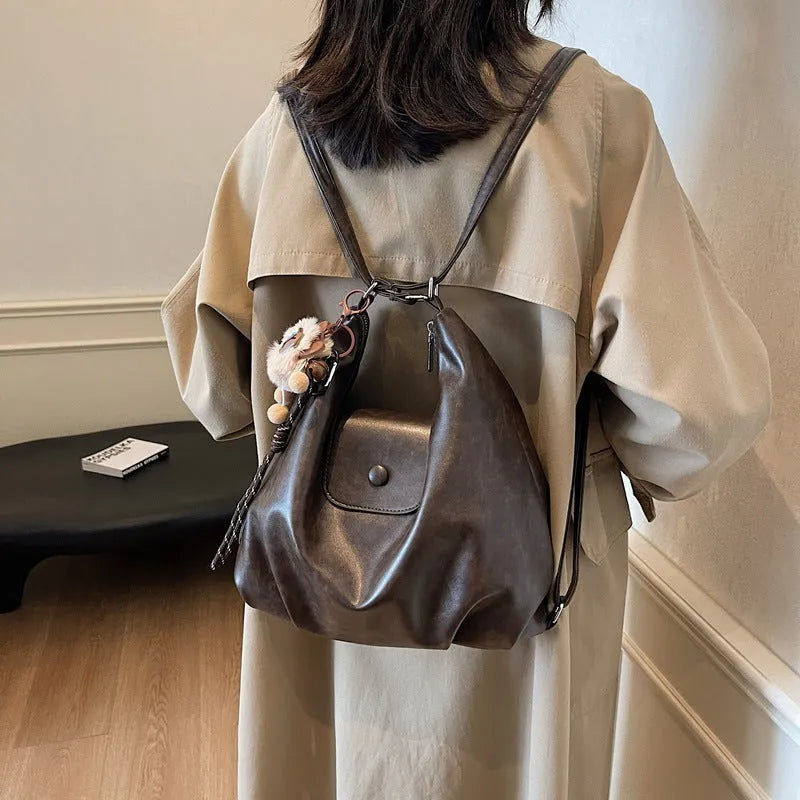 Textured PU leather women's single shoulder bag in horizontal square shape with optional pendant detail