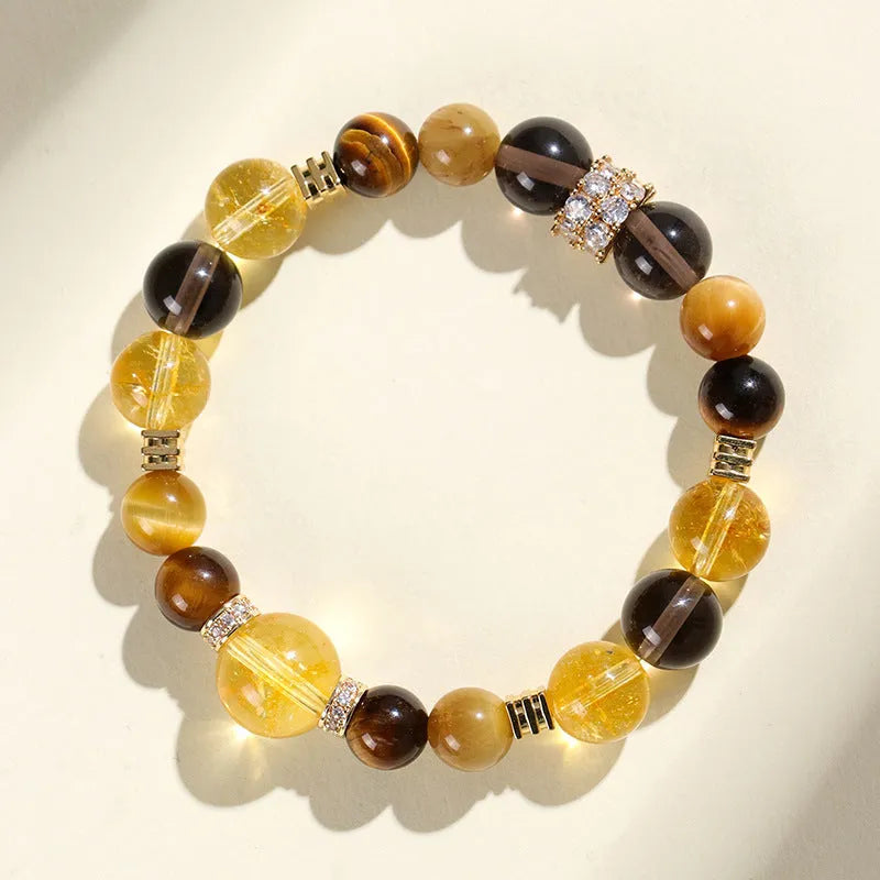 Natural yellow tower crystal string beads bracelet with 10mm Jinba design on wrist
