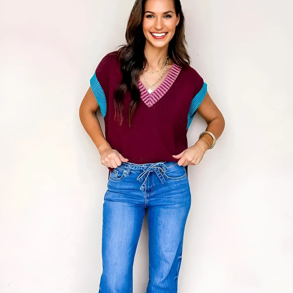 Burgundy women's loose sweater with contrast trim, V-neck, and cuffed short sleeves