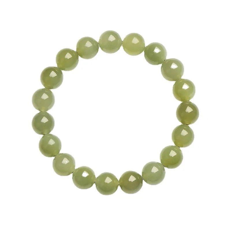 Polished Hetian jade bead bracelet in ice clear colour on a wrist, showing bead detail.