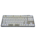 132 transparent plastic mechanical keyboard key caps laid out in grid pattern