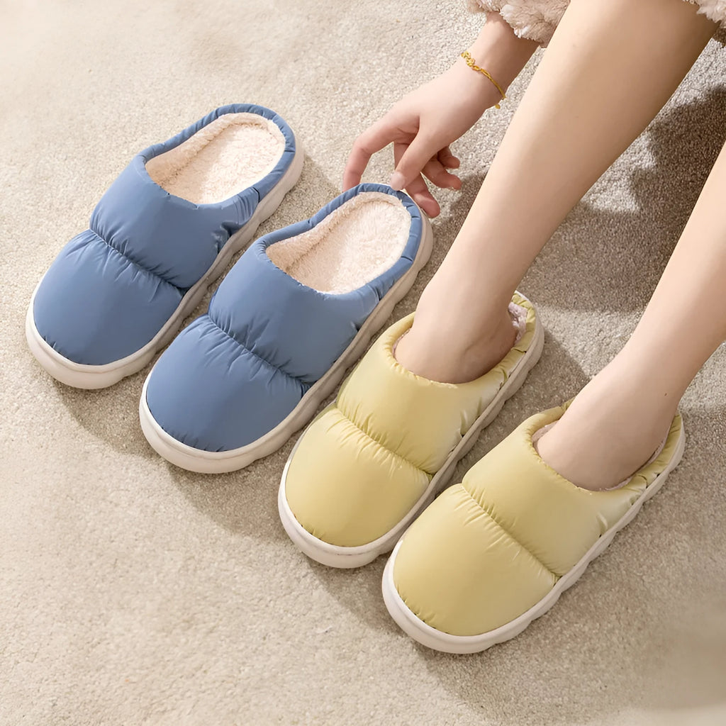 Down cotton slippers with artificial leather upper, rubber sole and plush lining in multiple colours