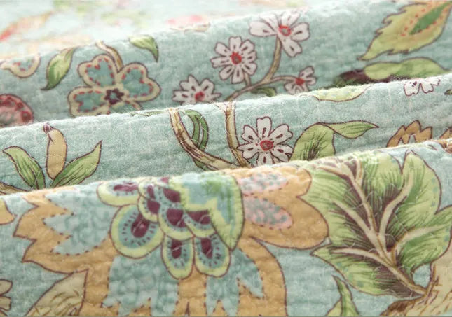 Blue cotton bedspread with floral patterns and quilted texture in American style bedding set