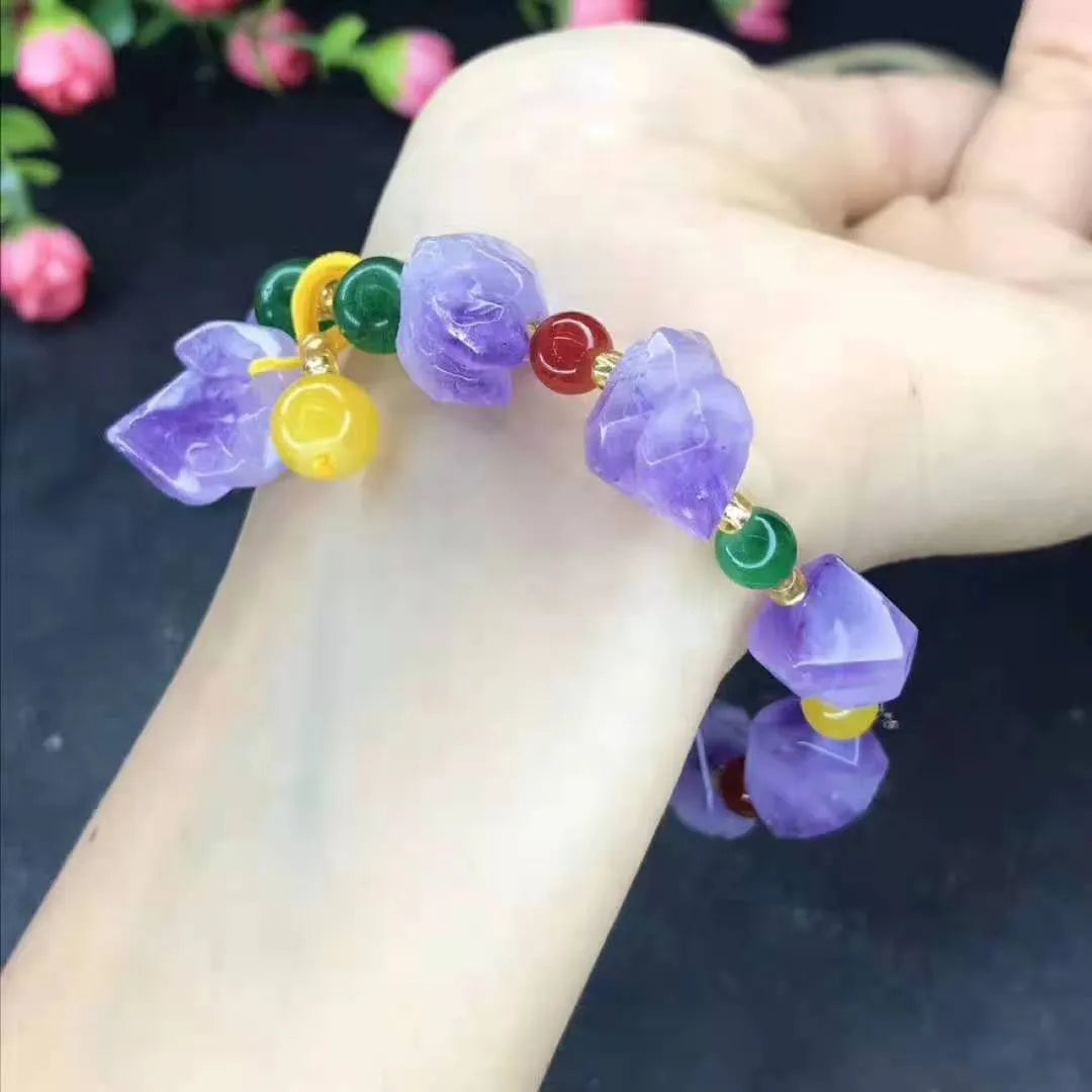 Natural shaped purple amethyst bead bracelet for women with a fu charm.