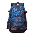 Blue and red classic nylon backpack showing large main compartment for school or travel.