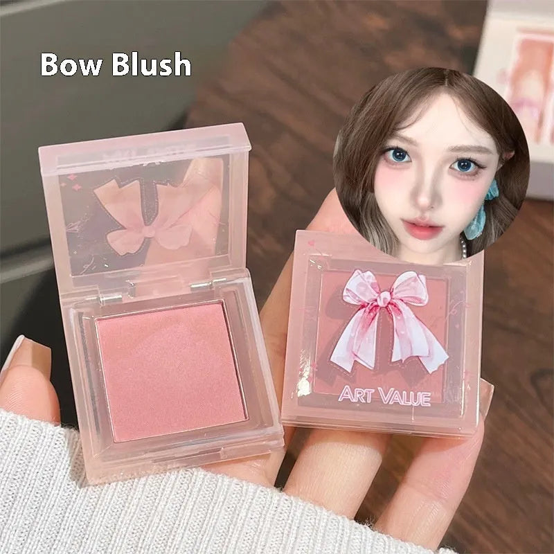 Butterfly Box makeup set showing four matte lip mud pots, powder blusher compact, and decorative necklace