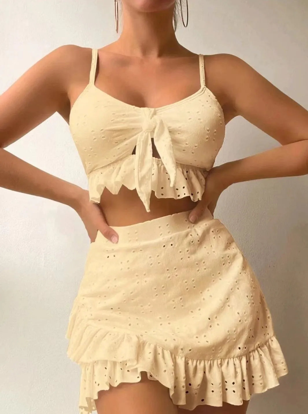 Women's three-piece bikini set with split hip skirt in polyester fabric for swimming
